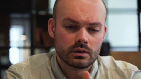 Stressed tired working young man in the office Видео 73037388