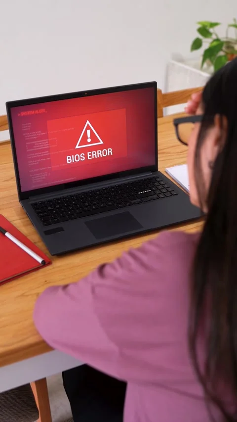 Stressed Woman Experiencing Bios Error During Startup On Her Laptop. - vertical Stock Footage 306147736