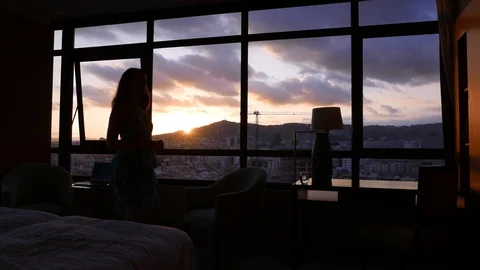 Stressed woman going forth and back against window Stock Footage 98891858