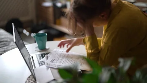 Stressed woman having financial problems with paying bills. Stock Footage 340276064