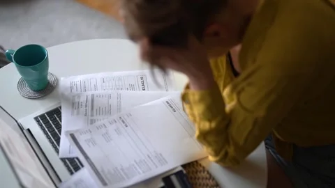 Stressed woman having financial problems with paying bills. Stock Footage 340276065