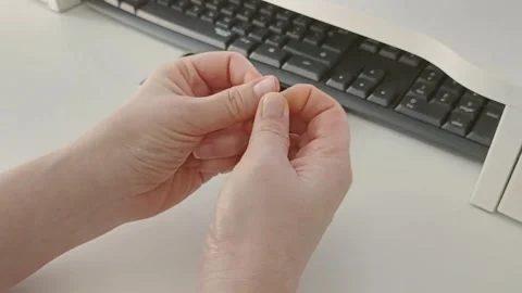 Stressed woman picking nails. Vídeos de archivo 331004306