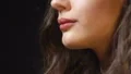 Stressed woman relaxing by smoking cigarette, hands shaking nervously, problem HD Footage
