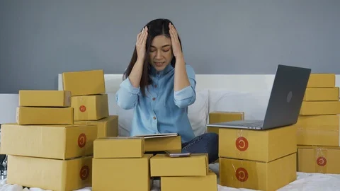 Stressed woman using laptop computer and working problem to selling product onli Stock Footage 128869536