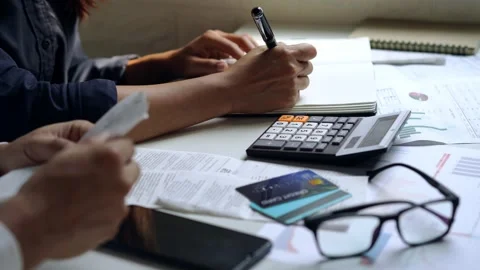 Stressed young couple checking bills and calculating expenses Видео 146433825