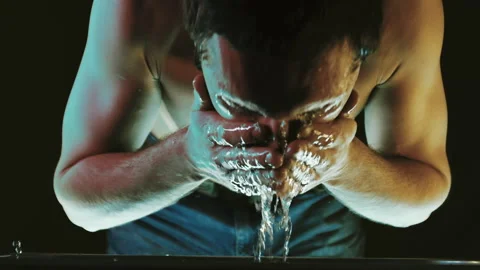 Stressed Young Man Splashes Water in His Face. Trying to Come to His Senses and Stock Footage 276410768