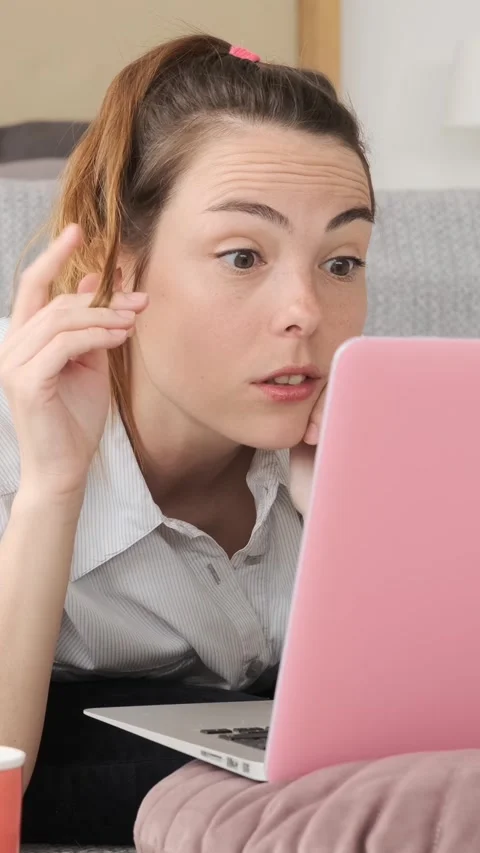 Stressed Young Woman Finding Solution on Laptop and Smiling Stock Footage 322790969