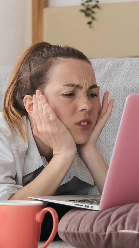 Stressed Young Woman Solving Problem and Celebrating on Laptop Stock Footage 322791141