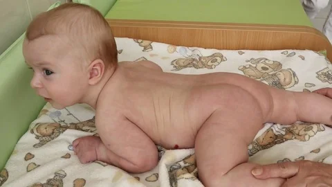 Stretch of 3-4 months old baby before bathing Stock Footage 75444236
