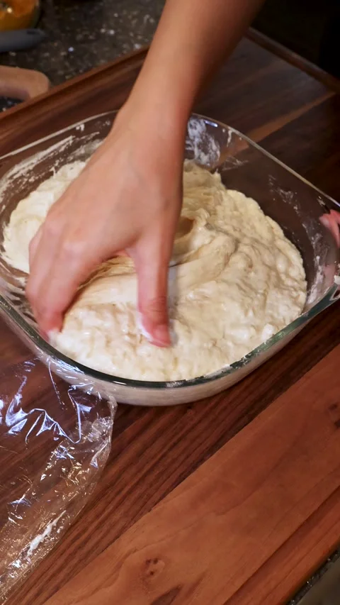 Stretch and Fold Technique for Bread Dough in Glass Bowl Stock Footage 330677581