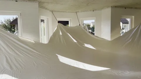 Stretch ceiling installation during home renovation. Stock Footage 219405850
