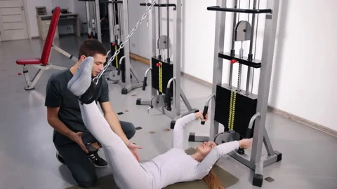 Stretch support, movement therapy, trainer patient Stock-Footage 306408184