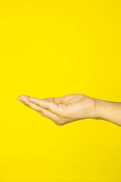 A stretched hand forming a supportive gesture on a bright background Stock-Fotos