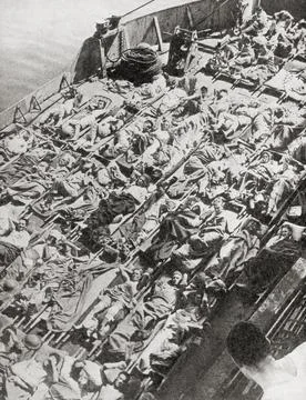 Stretcher cases, wounded at Syracuse, wait in landing craft to go aboard a hospi Stock Photos