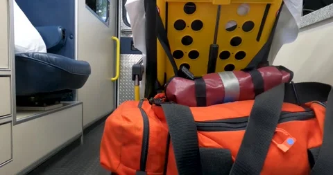 Stretcher removed form back of ambulance viewed from near airway seat Stock Footage 250314713