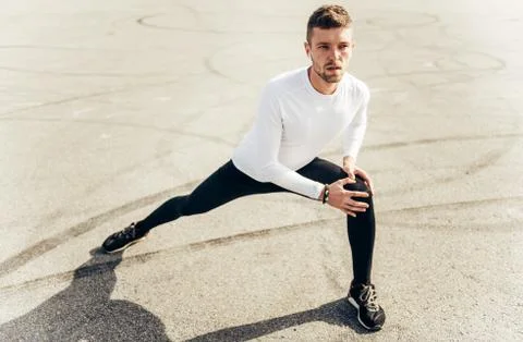 Stretching after great work out. Sport, workout, healthy lifestyle concept. Stock Photos