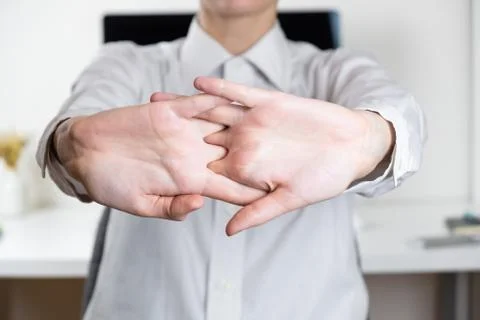 Stretching arms in sparse office workplace.  Stock Photos