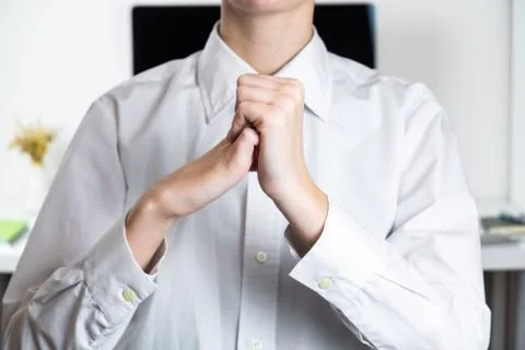 Stretching arms in sparse office workplace.  Stock Photos