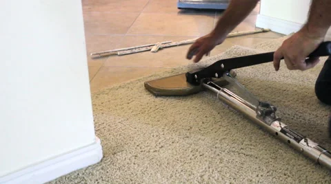 Stretching carpet for repairs Stock Footage 50809432