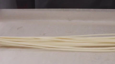 Stretching dough for hand-pulled noodles. Stock Footage 315590159