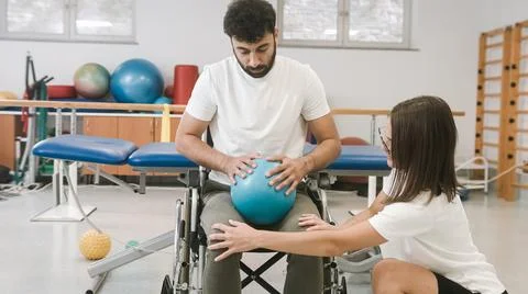 Stretching exercises for disabled persons Stock Photos
