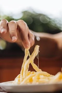 Stretching Fresh String Cheese Foto stock