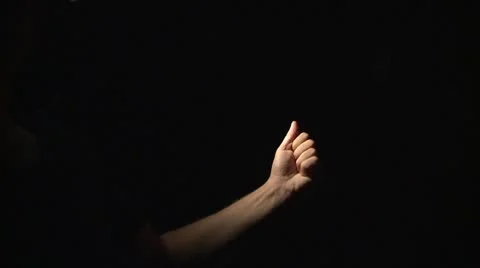 Stretching hand in the dark Stock Footage 8912735