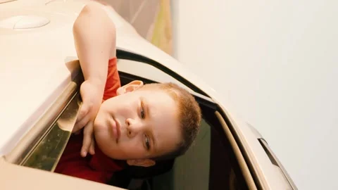 Stretching his hand out window, catching glare setting sun, traveling by car Stock Footage 277564548