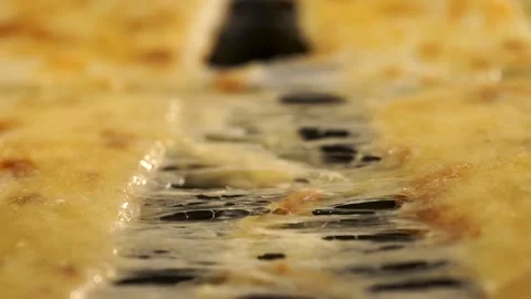 Stretching melted cheese on a mouth-watering pizza. Stock Footage