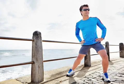 Stretching is not to be forgotten. Full length shot of a young male jogger Stock Photos