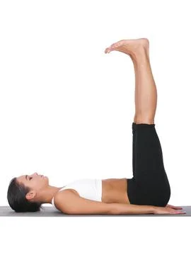 Stretching out her hamstrings. A young woman doing stretches while isolated on Stock Photos