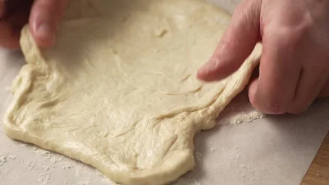 Stretching Pizza Dough on Table. Stock Footage 263364335