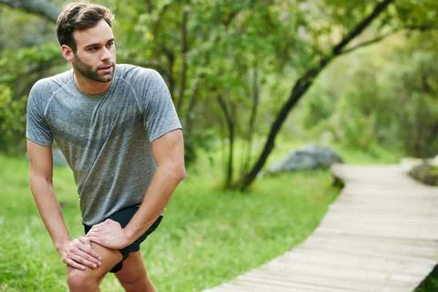 Stretching before running into action Foto stock
