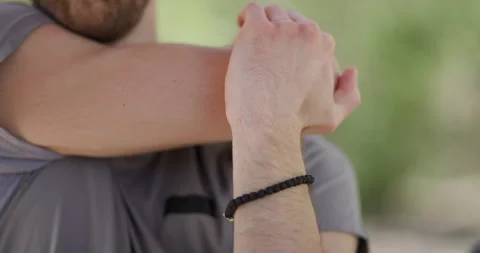Stretching techniques for improving flexibility during outdoor activities in a Stock Footage 346652299