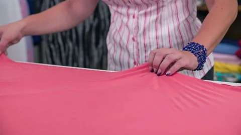Stretching textile before cutting close up Stock Footage 41012043