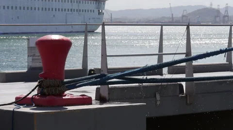 Stretching - tighten mooring rope on dock mooring pole. 1 of 2 Stock Footage 59442798