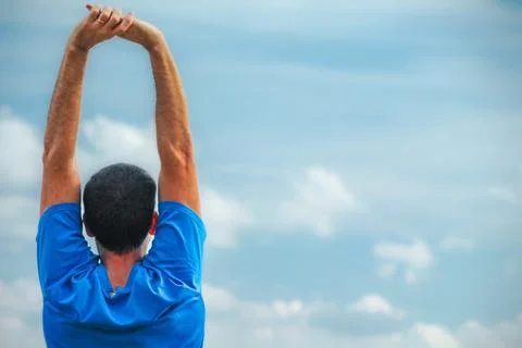 Stretching Under a Cloudy Sky Stock Photos