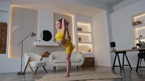 Stretching your legs while doing yoga Vidéo 175808033