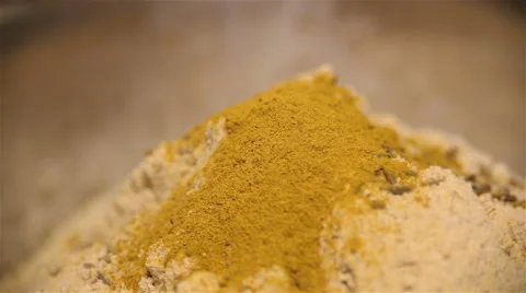 Strew a flour hill with cumin and turmeric by spice Vídeos de archivo 67461429