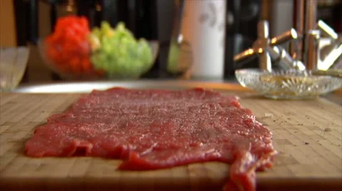 Strew salt pepper on beef roulade 10850 Stock Footage 18184712