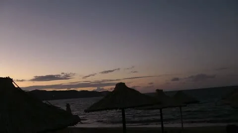 Strew umbrelas on the beach Stock Footage 8990120