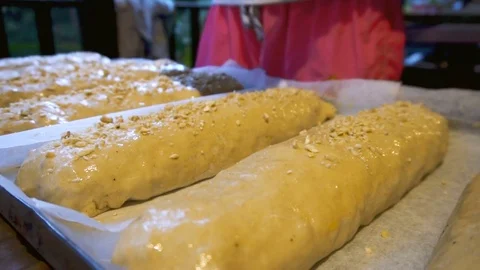 Strewing Strudel with Chopped Peanuts Video stock 77605961