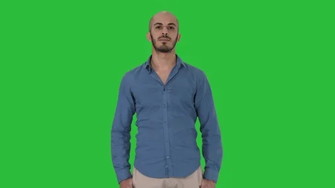 Strict arabic man standing and looking into camera on a Green Screen, Chroma Key Stock Footage 109310896