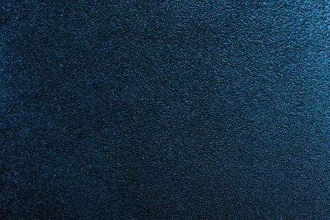 Strict dark stone rough background, selective focus, turquoise hue Stock Photos