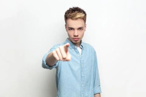 Strict man looking and indicating to camera, choosing you, you have problems Stock-Fotos