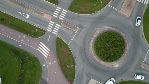 A strict top-down, bird's-eye view drone footage capturing vehicle traffic Stock Footage 345544709