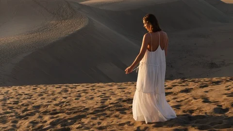 Striding along the sand dunes Stock Footage 106188563