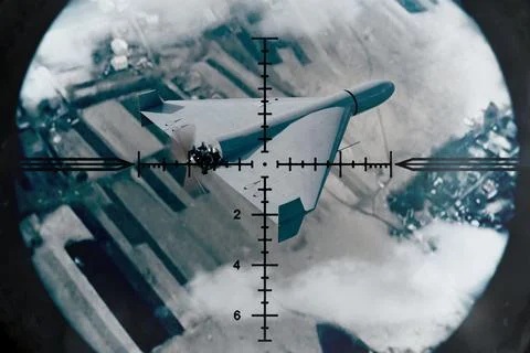 Strike drone observed from above through air defense sight Foto stock