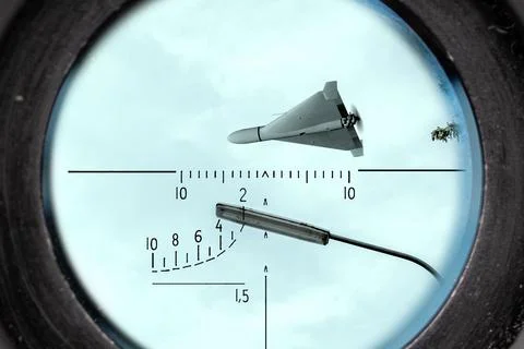 Strike drone observed through optical scope against sky as aerial security .. Stock Photos
