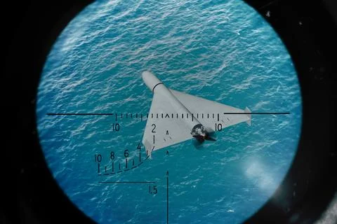 Strike unmanned drone performs mission over water in guidance and control zon Stock Photos